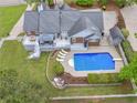 Aerial view showcasing a private backyard with a swimming pool and large deck at 8117 Spivey Rd, Jonesboro, GA 30236