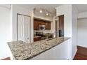 Updated kitchen featuring granite countertops, stainless steel appliances, and stylish cabinetry at 275 13Th Ne St # 605, Atlanta, GA 30309