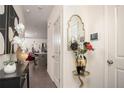 Inviting foyer with elegant mirror, stylish console table, and modern artwork leading into an open living space at 1296 Taylor Way, Stone Mountain, GA 30083