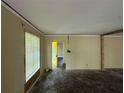 Bright living room featuring a yellow front door and a large window with natural light at 1417 Richland Rd, Atlanta, GA 30310