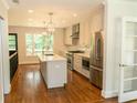 Modern kitchen with white cabinets, stainless steel appliances, and an island, ideal for cooking and gathering at 1468 North Amanda Cir, Atlanta, GA 30329