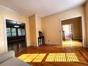 Bright living room featuring hardwood floors, crown molding, and natural light at 1225 Creek Laurel Dr, Lawrenceville, GA 30043