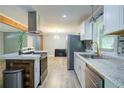 Modern kitchen with stainless steel appliances, sleek countertops, and a stylish island at 3627 Groovers Lake Rd, Lithia Springs, GA 30122