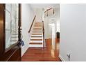 Inviting foyer with hardwood floors and a staircase leading to the upper level at 4260 Hammond Bridge Dr, Suwanee, GA 30024