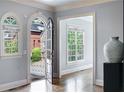 Inviting foyer with arched doorway, hardwood floors, and natural light at 1720 Buckhead Valley Ne Ln, Atlanta, GA 30324