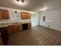 Well-lit kitchen offers ample counter space, wood cabinetry, and modern appliances at 1247 Shoreham Dr, Atlanta, GA 30349