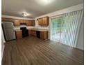 Bright kitchen featuring stainless steel appliances and wood-look flooring at 1247 Shoreham Dr, Atlanta, GA 30349