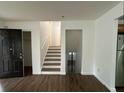 Spacious living room with new vinyl floors provides entrance to staircase and other living areas at 1247 Shoreham Dr, Atlanta, GA 30349
