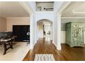 Grand foyer featuring hardwood floors, archway, and an open staircase to the second level at 4769 Moon Hollow Ct, Buford, GA 30519