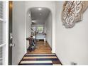 Inviting foyer with hardwood floors and an arched entryway to the living area at 1539 Creek Bend Ln, Lawrenceville, GA 30043
