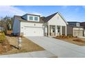 Picture of charming home with a two-car garage and inviting front porch at 1610 Savoy Way Way, Loganville, GA 30052