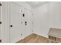 Bright hallway featuring hardwood floors, white walls, and doors at 1750 Clairmont Rd # 32, Decatur, GA 30033