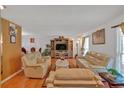 Bright living room featuring neutral-toned sofas, a cozy rug, and a decorative entertainment center at 316 Shiloh Hills Nw Dr, Kennesaw, GA 30144