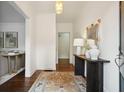 Bright entryway with hardwood floors, stylish rug, mirror, and decorative console table at 2672 Birchwood Dr, Atlanta, GA 30305