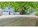 Spacious two-car garage and large driveway providing ample parking space at 3116 Lakepoint Cir, Acworth, GA 30102