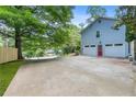 Spacious two-car garage and large driveway providing ample parking space at 3116 Lakepoint Cir, Acworth, GA 30102
