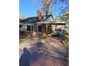 Rear view of the brick home with covered parking at 6 Rockmart Sw Dr, Atlanta, GA 30314