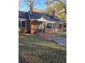 Charming brick home with covered entry and walkway at 6 Rockmart Sw Dr, Atlanta, GA 30314