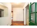 Bright entryway with hardwood floors, leading into the home at 1491 Boulderwoods Dr, Atlanta, GA 30316
