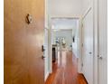 Hallway view of living room with hardwood floors and patio access at 870 Inman Village Ne Pkwy # 229, Atlanta, GA 30307