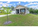 Well-maintained home with a manicured lawn, cozy front porch, and beautiful landscaping at 99 Oxford Ln, Kingston, GA 30145