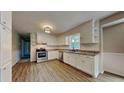 Bright kitchen featuring white cabinets, stainless steel appliances, and ample counter space at 11953 Brown Bridge Rd, Covington, GA 30016