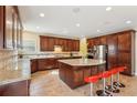 Beautiful kitchen featuring custom cabinets, stainless steel appliances, and granite countertops at 2120 Cain Commons Dr, Dacula, GA 30019