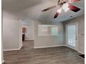 An open-concept living room boasts modern flooring, fireplace, and abundant natural light at 2429 Wood Bend Ln, Riverdale, GA 30296