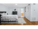 Bright bedroom featuring hardwood floors, a serene atmosphere and ensuite access at 1150 Collier Nw Rd # 25D, Atlanta, GA 30318