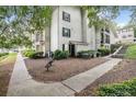 Exterior view of the condo building surrounded by lush landscaping, creating a serene setting at 1150 Collier Nw Rd # 25D, Atlanta, GA 30318