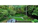 Secluded backyard featuring a fire pit, ample seating, and lush greenery, perfect for relaxing at 2804 Dunnington Cir, Chamblee, GA 30341
