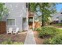 Inviting townhome featuring a quaint front entrance, private outdoor space, and mature landscaping at 82 Twiggs Cor, Peachtree City, GA 30269