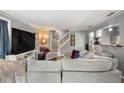 Comfortable living room with hardwood floors, staircase, and an open layout, great for relaxation at 82 Twiggs Cor, Peachtree City, GA 30269