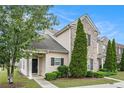 Townhome featuring landscaped front yard, attractive exterior elements, and inviting entrance at 2555 Flat Shoals Rd # 801, Atlanta, GA 30349