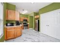 Bright kitchen with stainless steel appliances, marble floors, and wooden cabinets at 2555 Flat Shoals Rd # 801, Atlanta, GA 30349