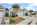 Beautiful home featuring a two-car garage, manicured lawn, and decorative shutters at 329 Acuba Vw, Woodstock, GA 30188