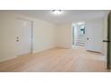 Spacious living room with hardwood floors and a bright, airy feel with staircase in view at 8432 Magnolia Dr, Jonesboro, GA 30238