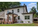 Exterior view showcasing the home's architectural details, including the front porch and tidy landscaping at 1721 S Gordon Sw St, Atlanta, GA 30310