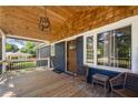 Cozy front porch with wood ceiling and chairs at 3770 Ponderosa Ln, Powder Springs, GA 30127
