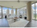 Bright living room featuring floor-to-ceiling windows and neutral-toned decor at 1080 Ne Peachtree Ne St # 2802, Atlanta, GA 30309
