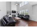 Bright living room with high ceilings, large windows, fireplace, and hardwood floors at 3422 Hopi Pt, Lawrenceville, GA 30044
