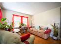 Bright living room featuring hardwood floors, large windows, and comfortable sofa at 1336 Sharon St, Atlanta, GA 30314