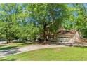 Beautiful home with mature trees, a spacious lawn, and an attached two-car garage at 2917 Rockbridge Rd, Marietta, GA 30066