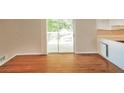 Dining area features hardwood floors and sliding glass doors to deck at 6575 Wendell Cir, Morrow, GA 30260