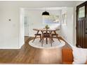 Cozy dining area with hardwood floors, modern lighting, and seating for four at 1142 Palafox Ne Dr, Atlanta, GA 30324