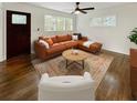 Bright living room featuring hardwood floors, ample natural light, and stylish furnishings at 1142 Palafox Ne Dr, Atlanta, GA 30324