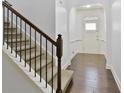 Inviting entryway with hardwood floors, stairs and bright white walls and trim at 2249 Knoxhill Se Vw, Smyrna, GA 30082