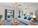 Bright living room featuring a large mirror, plush seating, and stylish decor at 221 Semel Nw Dr # 273, Atlanta, GA 30309