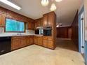 Functional kitchen featuring classic oak cabinetry and modern appliances at 2636 Whiteleigh Ne Ct, Atlanta, GA 30345