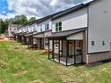 New construction townhomes each boast a private covered patio and a well-maintained backyard at 5720 Urban Village Way # 7, Tucker, GA 30084